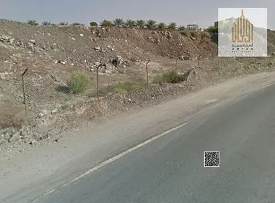 Investment Opportunity: Residential/Commercial Land for Sale in Masfout 1, Prime Tourist Location.