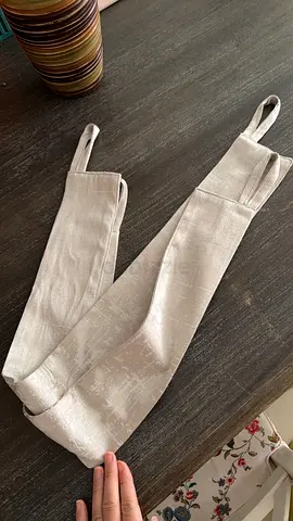 Pair of beige fabric curtain tiebacks