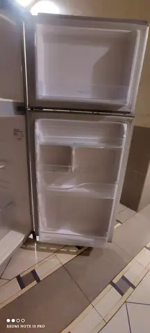 Small top-freezer refrigerator in good working condition