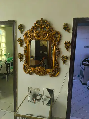 Ornate Gold Wall Mirror with Decorative Appliques