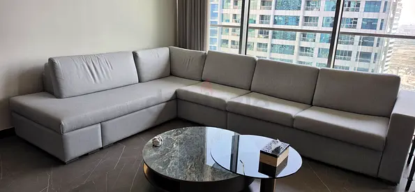 Light grey L-shaped fabric sectional sofa - good condition