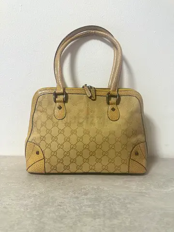 Gucci-style monogram handbag with yellow leather trim
