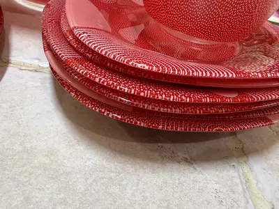 Set of red speckled ceramic plates and bowls - used, good condition
