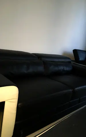 Black leather 6-seater sofa in good condition