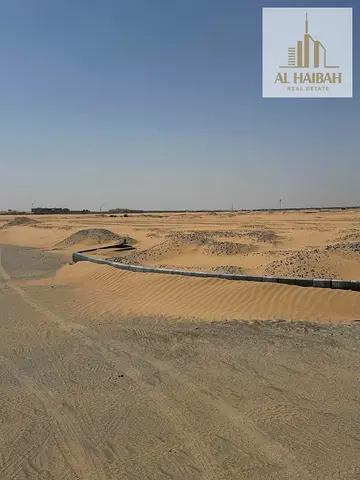 Land for sale in Al Bulaydah 1, Sharjah, directly on Maliha Road, 2907 sq ft, at a bargain price and with installments available.