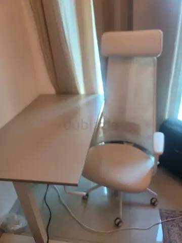 Beige swivel office chair with headrest - good condition