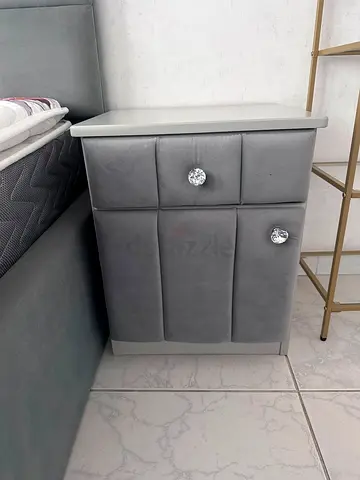 Grey upholstered bedside cabinet with crystal knobs - good condition
