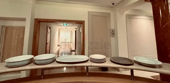 Set of decorative ceramic plates on display stand (used)