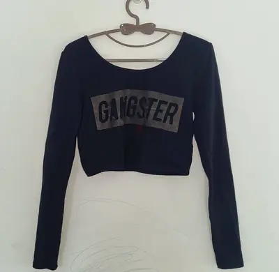 Black long-sleeve cropped top with GANGSTER print