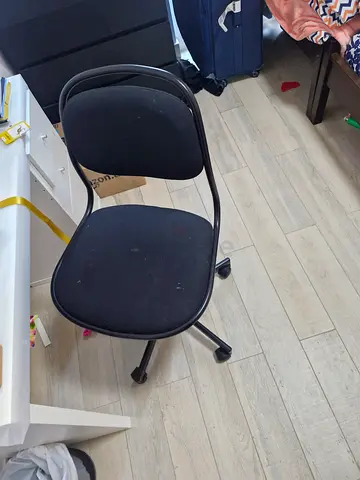 Simple black swivel office chair — good condition