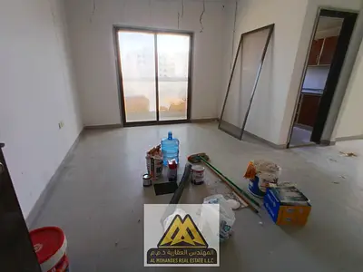 Two rooms for rent in Al Jurf Industrial 2 – Balcony + open view | Excellent size | Prime location | Free maintenance