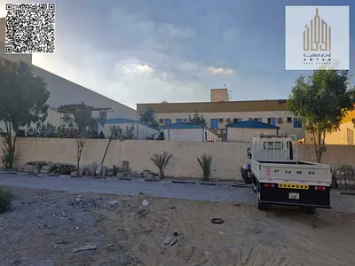 Commercial land on a front and back street and a large alley Commercial land for sale in Ajman Al Jurf Industrial Area 3 Corner of two streets and a