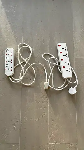 Two white multi-socket extension cords with surge switches (used)