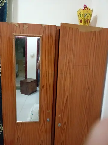 Two-door wooden wardrobe with mirror - good usable condition