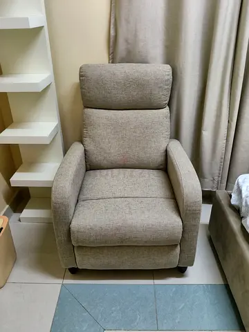 Single beige fabric recliner armchair - good condition