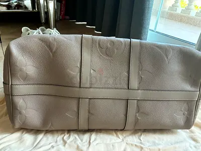 Beige embossed leather travel duffel bag LV original