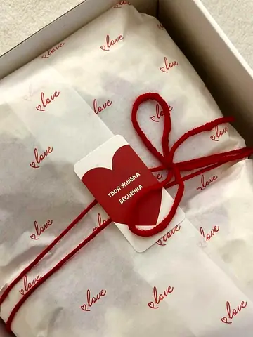 Lightly used gift box with love-themed wrapping