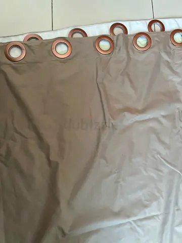 Pair of beige blackout curtains with grommets – good condition