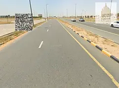 Residential and commercial corner land in Al Bahia