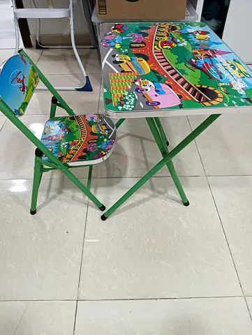 Kids foldable table and chair set with colorful train print - good condition