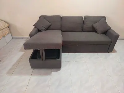 Grey L-shaped sofa with storage and chaise, good condition