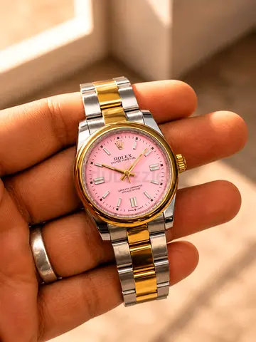 Rolex style two-tone wristwatch with pink dial