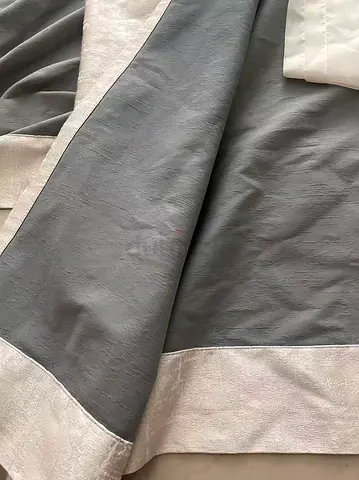 Pair of beige fabric curtain