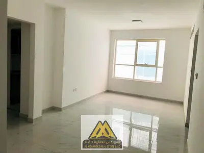 For rent: 2-bedroom apartment with hall in Al Helio 2. Spacious layout, 2 bathrooms, central AC, dressing wardrobes, prime location. AED 35,000 in 6 p