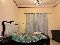 Kerala Family Sharing Master Bedroom Near Dubai Border