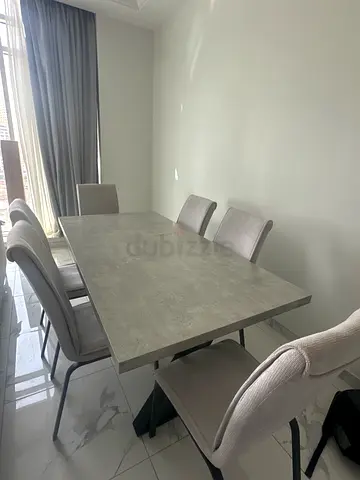 Modern grey dining table with 6 upholstered chairs - good condition
