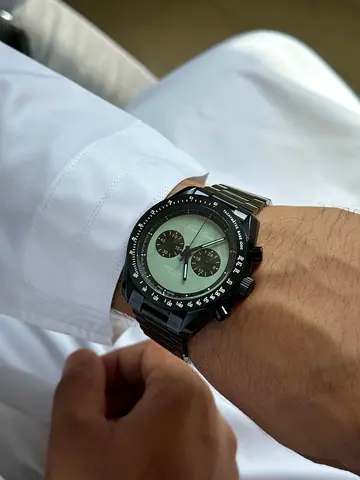 Louis Erard chronograph features a striking panda dial design with high-contrast black subdials.