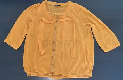 Mustard yellow semi-sheer blouse with tie neck