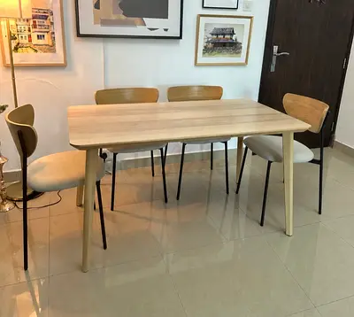 Light wood dining table with 4 chairs