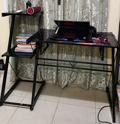 Black glass top computer desk with attached shelving - used