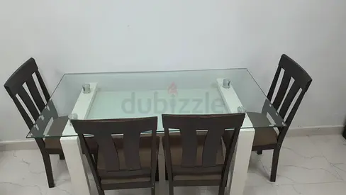 Glass Top Dining Table with 4 Dark Wood Chairs - Good Condition