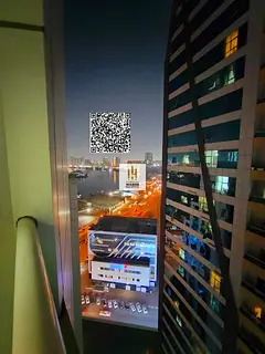 For sale in Orient Towers, Ajman: 2 bedrooms, living room with balcony overlooking the creek, 2 bath