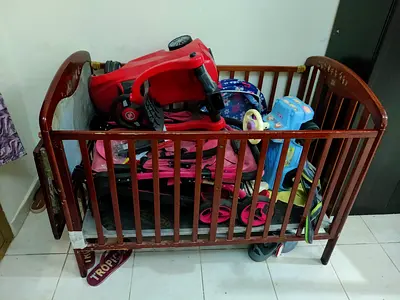 Wooden baby crib (used) with inbuilt study table sturdy.