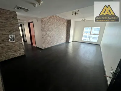 Two-bedroom apartment in Al Rashidiya 3, Ajman, two bathrooms, balcony, parking, close to services, AED 46,000, four cheques.