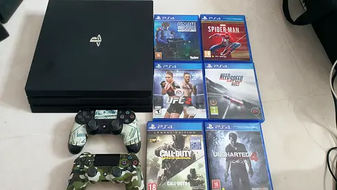 Sony PlayStation 4 Pro Console Bundle with 2 Controllers and 6 Games