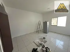 Studio for annual rent in Al Rashidiya 3 in Ajman, in a prime location on a main street opposite Ajm