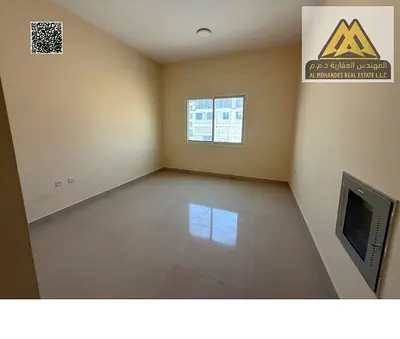 Studio in Al Alia with separate kitchen, split AC, and free maintenance. AED 20K yearly, 4 payments, large space, near Dubai exit, Sheikh Mohammed Bin