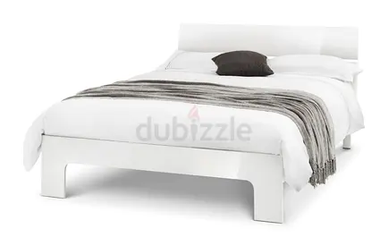 A clean white finish queen mdf bed frame