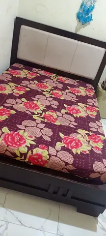 Queen size wooden bed frame with headboard and mattress