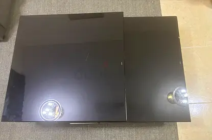 Black glossy modern coffee table with sliding top (Need some fixation for bottom glass) Overall Good