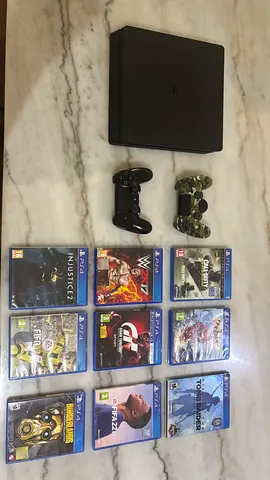 PlayStation 4 Slim with 2 Controllers and 10 Games - Good Condition