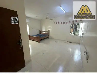 For rent in Al Nakheel 1, Ajman: large studio with separate kitchen, split AC, 17,000 AED yearly in 4 installments, near Corniche and all services.