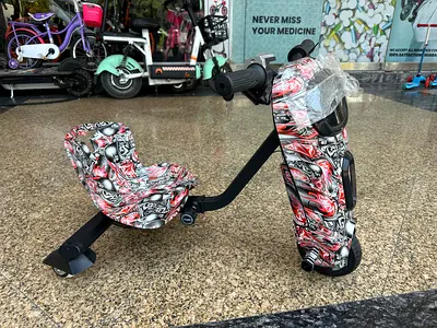Drift Trike Electric Ride-On Kart with Graphic Wrap - Good Condition