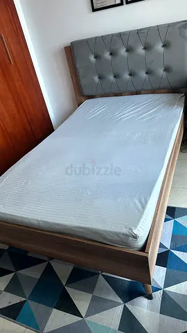 Single wooden bed frame with upholstered headboard - good condition with mattress