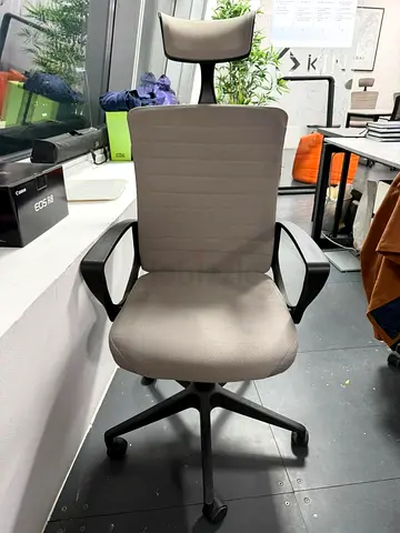 Grey ergonomic office chair with headrest - good condition