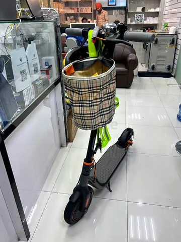 Foldable electric scooter with front basket - used, good condition